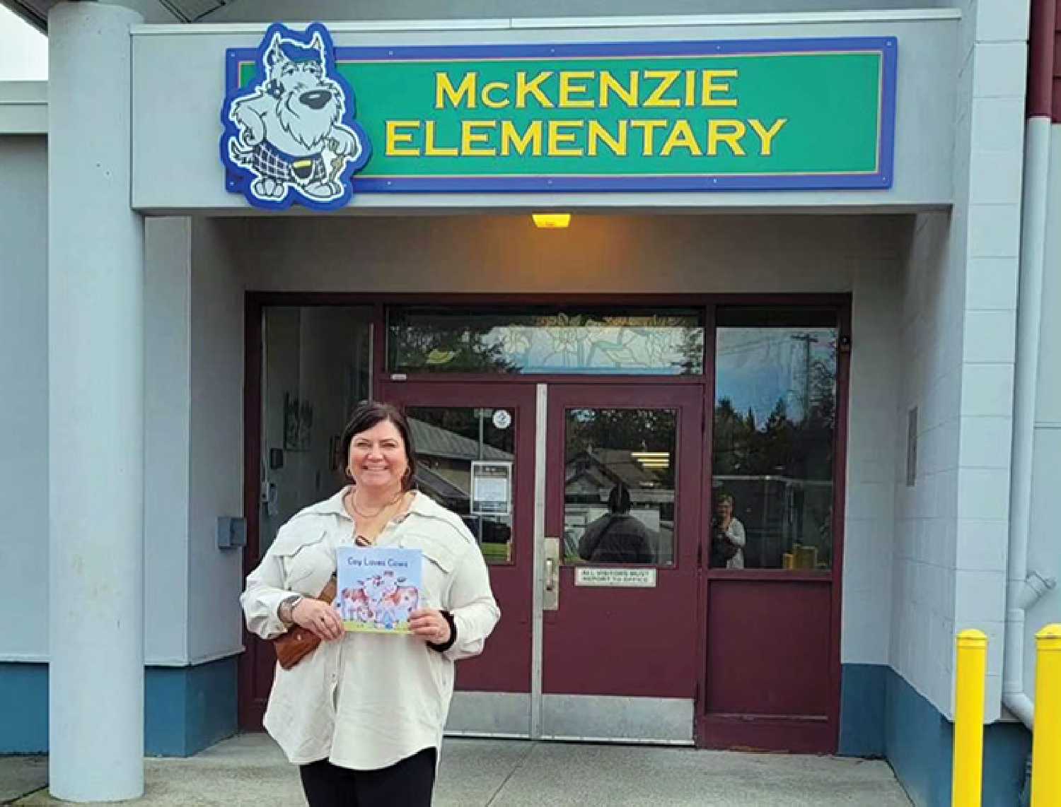 Ellie Reid Rookes with her book at McKenzie Elementary.